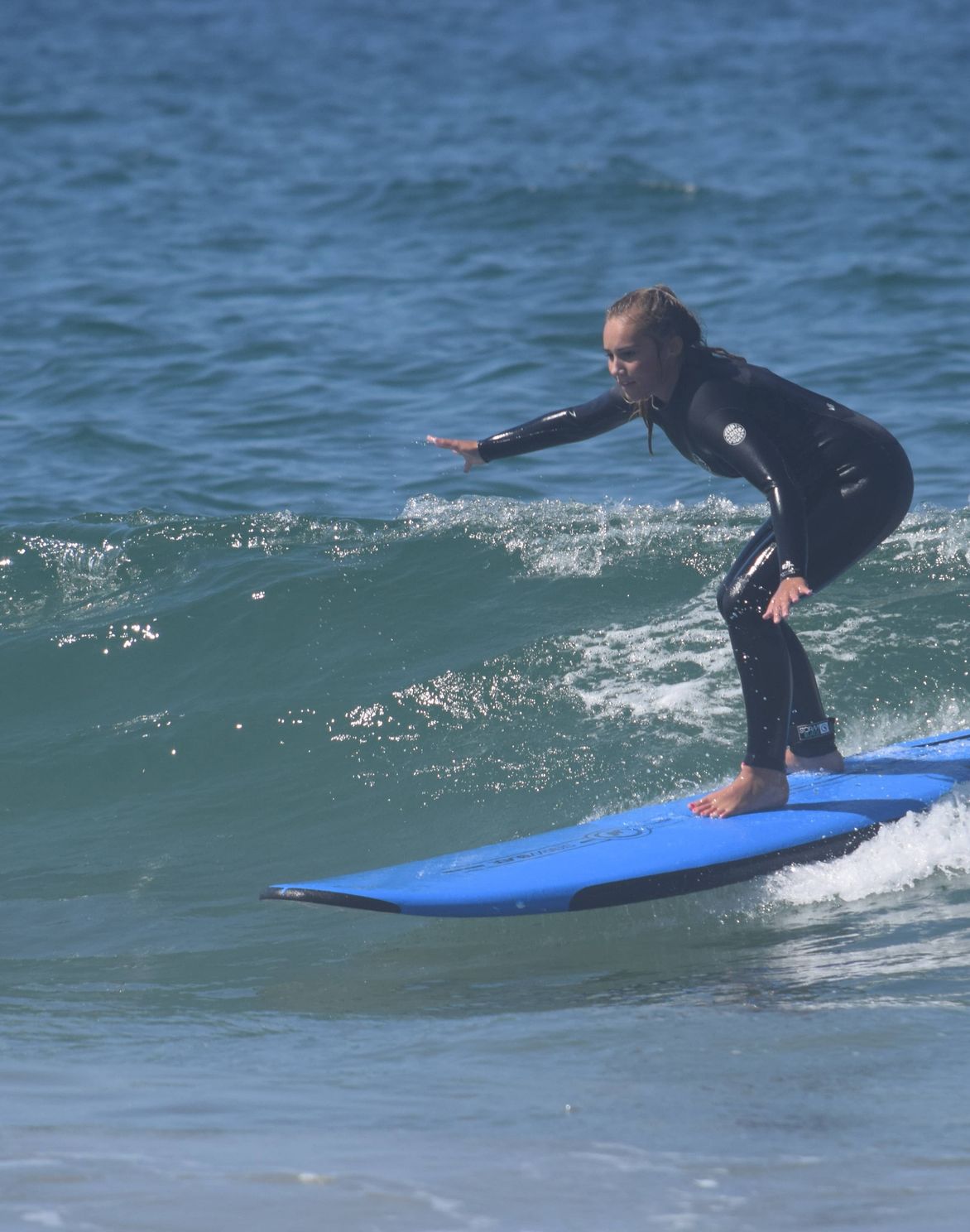 surfing instructor teaches youth at Frisco