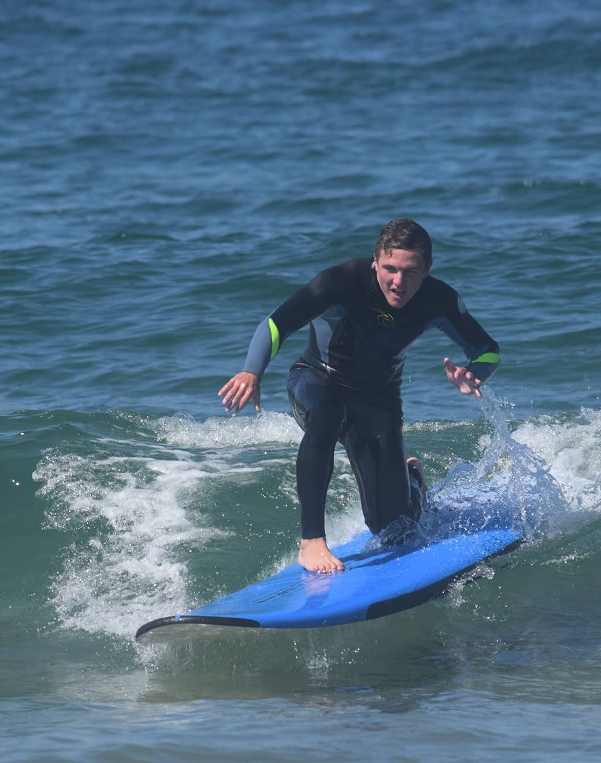 new student paddling in the water