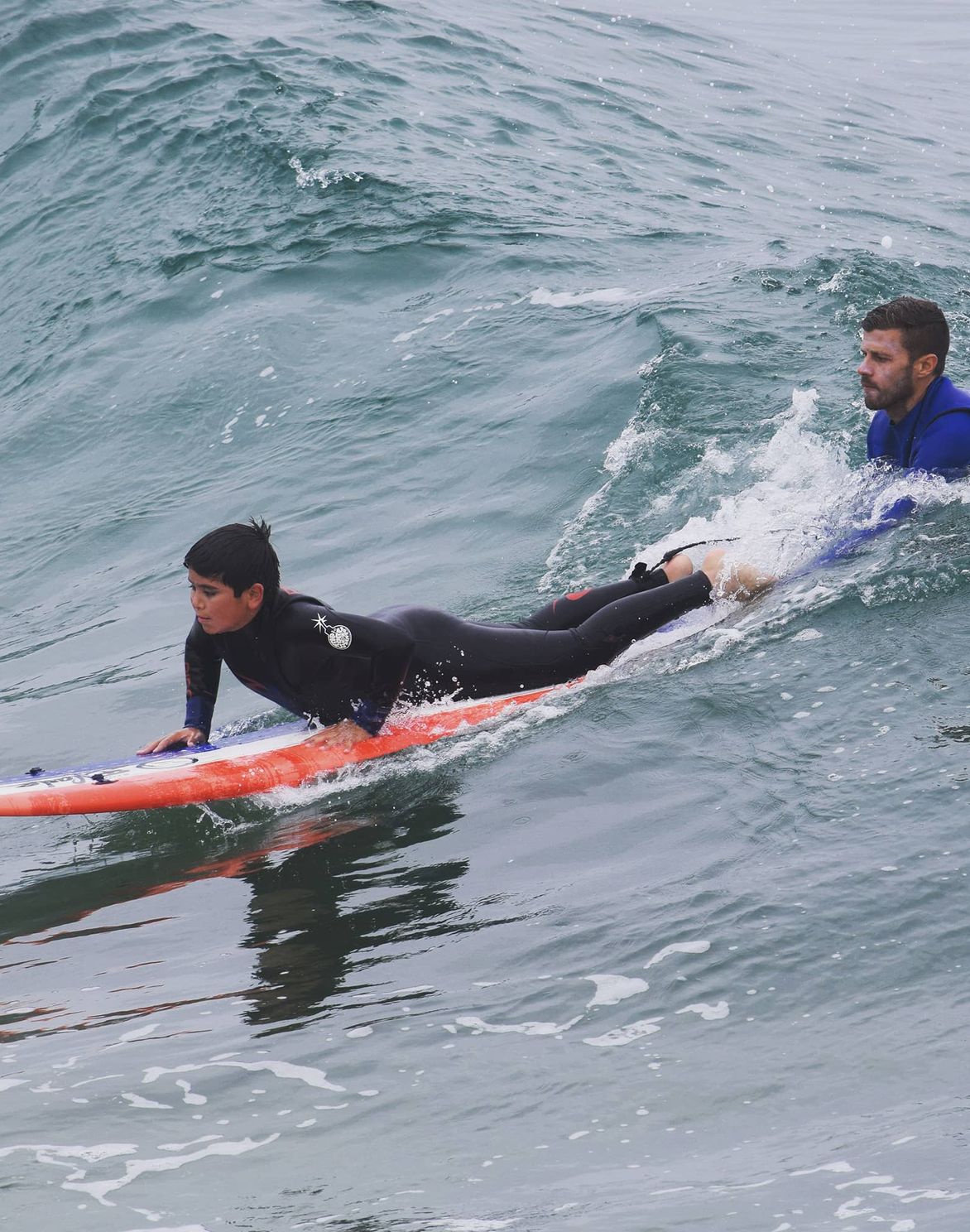 surfing instructor teaches youth at Rodanthe